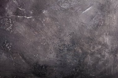 Banner of textured dark concrete background with empty, free or copy space for advertising text