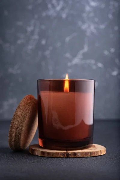 Cozy Burning Candle Brown Glass Jar Dark Background — Stock Photo, Image