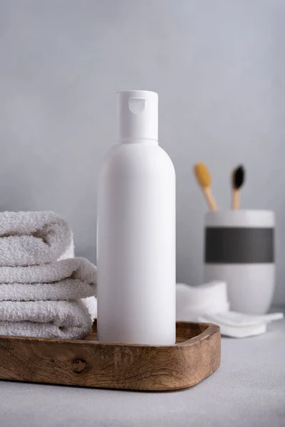 Stock image White empty shampoo or lotion bottle for mock-up in Scandinavian bathroom interior