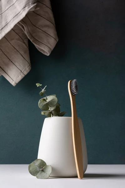 stock image Eco-friendly bamboo toothbrushes in a white holder. Zero waste, plastic free, sustainable lifestyle concept.