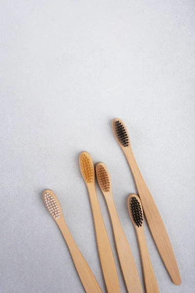 stock image Bamboo toothbrushes on gray background for sustainable lifestyle concept