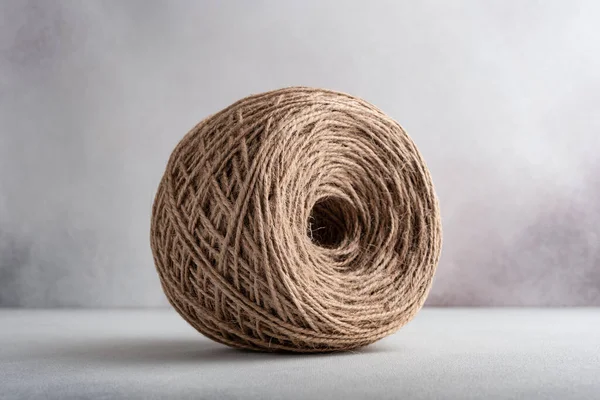 Skein of jute rope for craft and handmade on a gray background