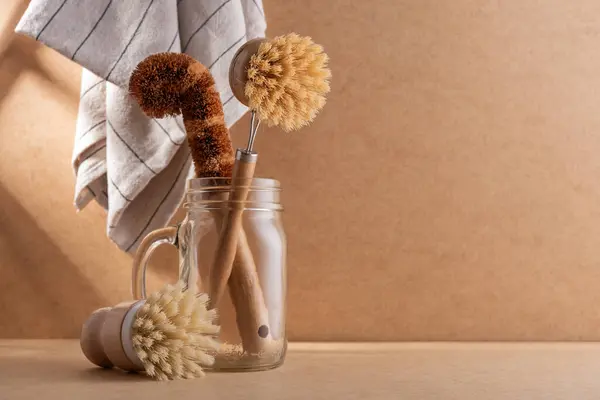 Set of bamboo brushes for dish wash and kitchen cleaning. Zero waste eco friendly cleaning concept.