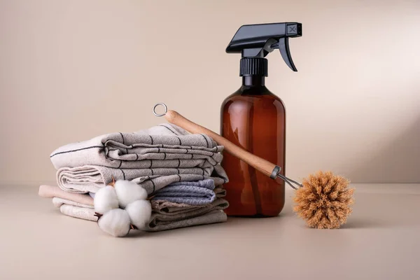 Eco wooden dish brush and spray bottle with an organic cleaner. Kitchen cleaning concept for eco-friendly and sustainable lifestyle.