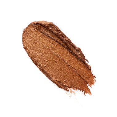 Beyaz arka planda izole edilmiş bronz ya da altın rengi ruj ya da krem rengi göz farı. Ruj soyut vuruşlar.