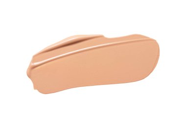 Makyaj vakfı, bej kapatıcı kumaş, beyaz arka planda karalama. BB CC krem dokusu.