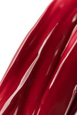 Pürüzsüz deseni ve yüksek parlaklığı olan parlak kırmızı tırnak jeli lekesi. Canlı ve zarif kozmetik ürün arka plan güzellik, moda ve cilt temaları için mükemmel.