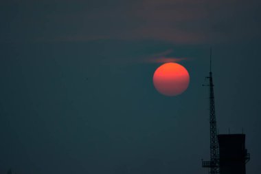 Fantastic sunset. A huge red sun goes to the west. Space landscape.