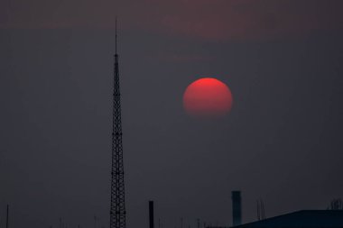 Fantastic sunset. A huge red sun goes to the west. Space landscape.
