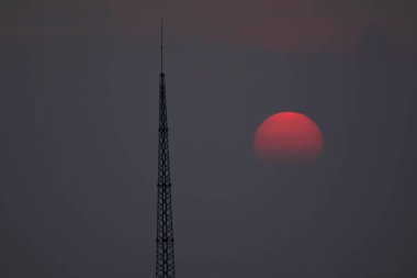 Fantastic sunset. A huge red sun goes to the west. Space landscape.