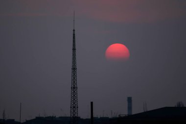 Fantastic sunset. A huge red sun goes to the west. Space landscape.