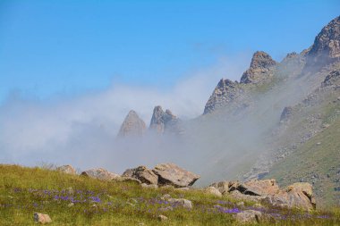 beautiful landscape with mountains and clouds clipart