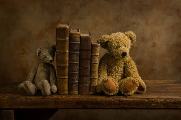Books and stuffed bears on rustic shelf