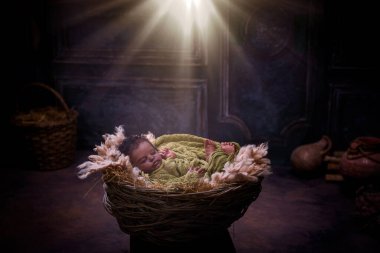 Reenactment of Christmas Nativity Scene with an African newborn baby doll  clipart