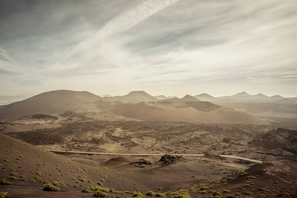 stock image View on the volcanic landscape of Timanfaya National Park on the Canary Island of Lanzarote in Spain. Beauty in nature.