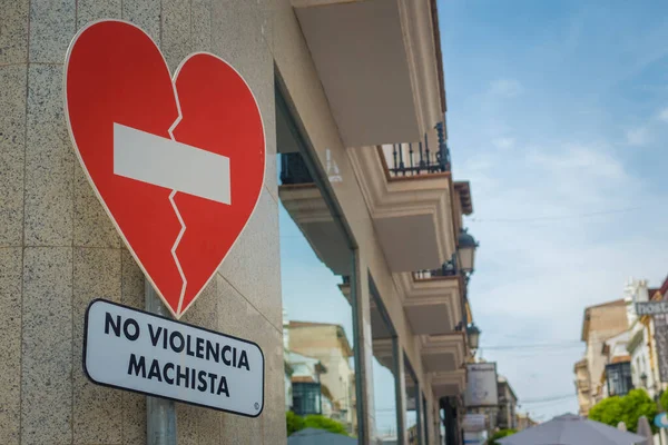 stock image Ronda, Spain, April 2022: No violencia machista traffic sign seen in a shopping street in Spain against transgressive behaviour