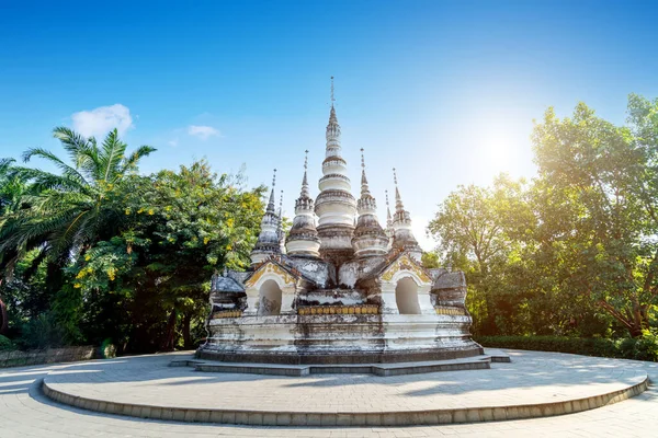 White pagoda in Buddhist temple in Xishuangbanna, Sipsongpanna, or Sibsongbanna in the south of Yunnan province, People\'s Republic of China.