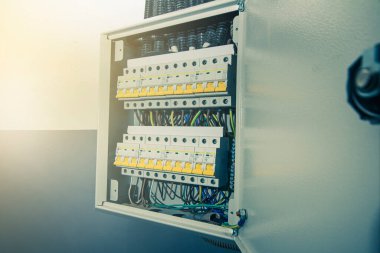 Switchboard equipment. Shield for enterprise electrification. Switchboard for control over electrical equipment. Labeled panel with wires and switches at the enterprise