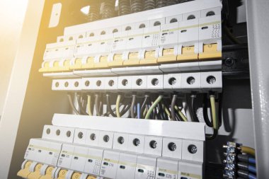Switchboard equipment. Shield for enterprise electrification. Switchboard for control over electrical equipment. Labeled panel with wires and switches at the enterprise