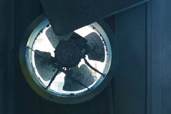 rotating fan impeller in the spray booth of a car paint shop close-up