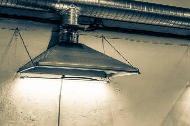 close-up of exhaust hoods in hazardous production, together with an air removal system, photographed immediately after installation work