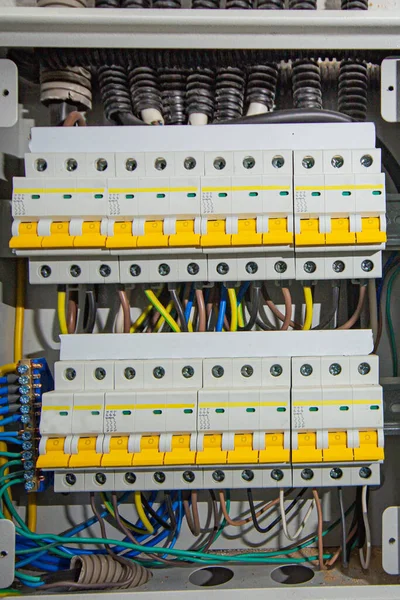 Switchboard equipment. Shield for enterprise electrification. Switchboard for control over electrical equipment. Labeled panel with wires and switches at the enterprise