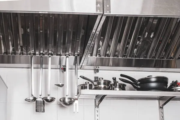 professional hood in a restaurant kitchen made of stainless steel with galvanized duct