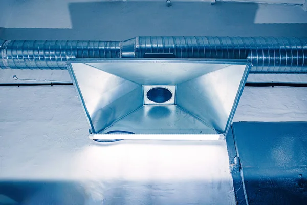 exhaust hood in a large production facility in harsh conditions of harmful gases and dust, close-up