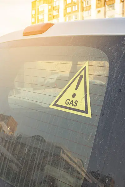 sticker on a car warning that the car is powered by propane gas fuel