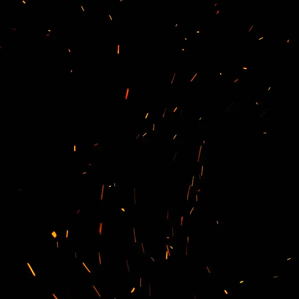 Siyah arkaplanda kıvılcımlar ve ateş