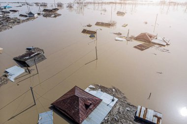 flood in the spring in the suburbs of a large city with flooding of the private sector and household plots clipart