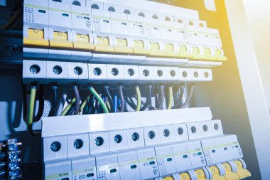 Switchboard equipment. Shield for enterprise electrification. Switchboard for control over electrical equipment. Labeled panel with wires and switches at the enterprise