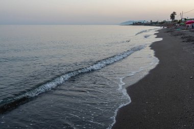 Serene Evening Waves on a Quiet Beach in Malaga, İspanya