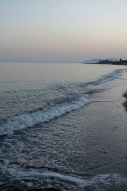 Serene Evening Waves on a Quiet Beach in Malaga, İspanya