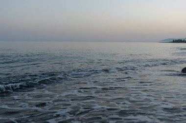 Serene Evening Waves on a Quiet Beach in Malaga, İspanya