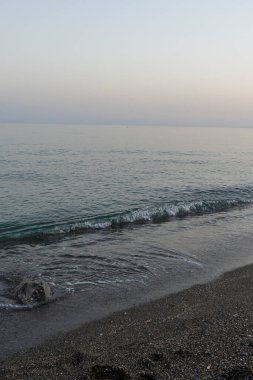 Serene Evening Waves on a Quiet Beach in Malaga, İspanya
