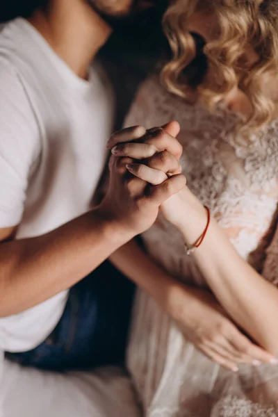 Man holding womans hands. Young couple enjoying coffee and lovely conversations in the romantic evening atmosphere. . High quality photo
