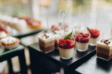 Delicious wedding reception candy bar dessert table. High quality photo