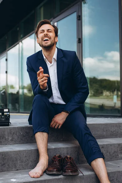 a cheerful man in a suit laughs. High quality photo