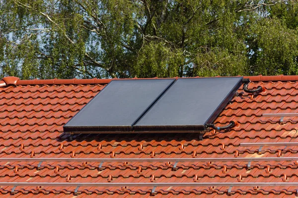 stock image solar panel rooftop on building roof with construction scaffold in south germany sunny spring day