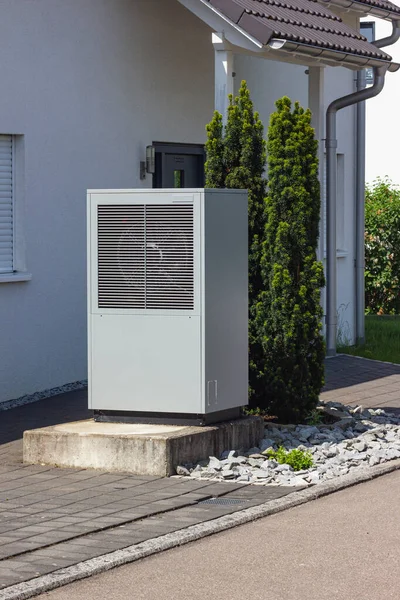 stock image heat pump in a new building area with modern house facades of south germany on a sunny day in springtime