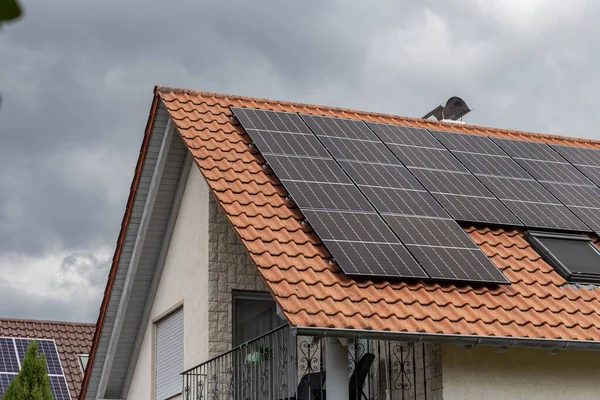 new building area wit solar panel on rooftop in south germany with cloudy sky weather