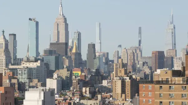 Stock image New York City Manhattan skyline cityscape. Empire State Building. Rooftop, residential houses roofs. Real Estate, urban architecture, United States streets. Midtown district from East Village, NYC.