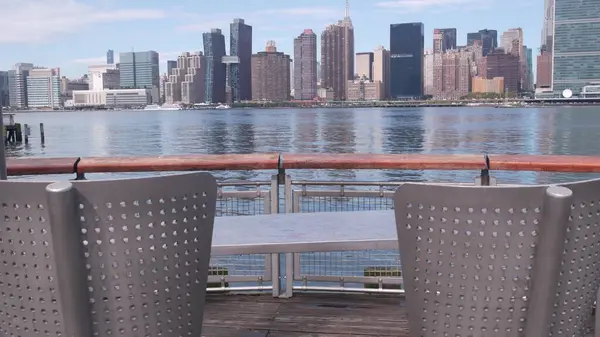 stock image New York City waterfront skyline, Manhattan Midtown buildings, riverfront skyscrapers by East river water. Waterside cityscape view, Gantry Plaza pier, Long Island, Queens. United States architecture.