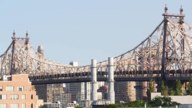 New York City Manhattan skyline cityscape. Queensboro Bridge from Queens to Midtown. Rooftop view point, roof in Long Island, United States. NYC urban architecture in Hunters Point clipart