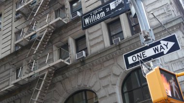 New York City crossroad, William street intersection road sign. NYC Manhattan downtown financial business district architecture, United States. Corner roadsign, house with fire ladder, traffic light. clipart