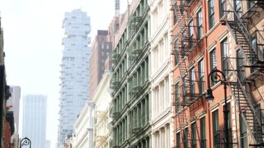 New York City Manhattan Soho fashion district near Broadway street. USA urban building facade, old classic american architecture. Shopping in NYC, United States. Business and residential real estate. clipart