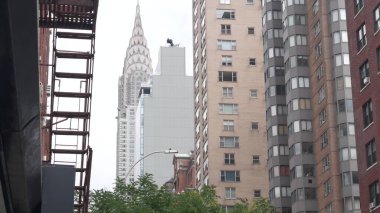 New York City Manhattan Midtown 42 street architecture. Chrysler building, iconic high-rise skyscraper, Lex Lexington avenue, USA. American urban residential red brick house, NYC tower, United States. clipart