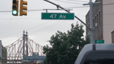 New York City street crossroad, yellow traffic light, transport road intersection. Queens, Long Island, Hunters Point, NYC, United States. Queensboro bridge. clipart