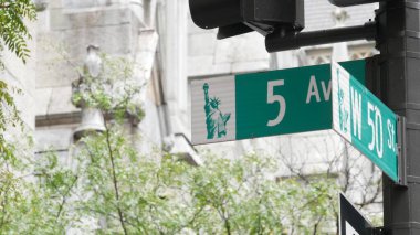 New York City, United States of America - 11 September 2023: Fifth avenue, 5 ave road sign, Manhattan midtown architecture, 5th av street corner. Traffic crossroad signage. St. Patricks Cathedral. clipart